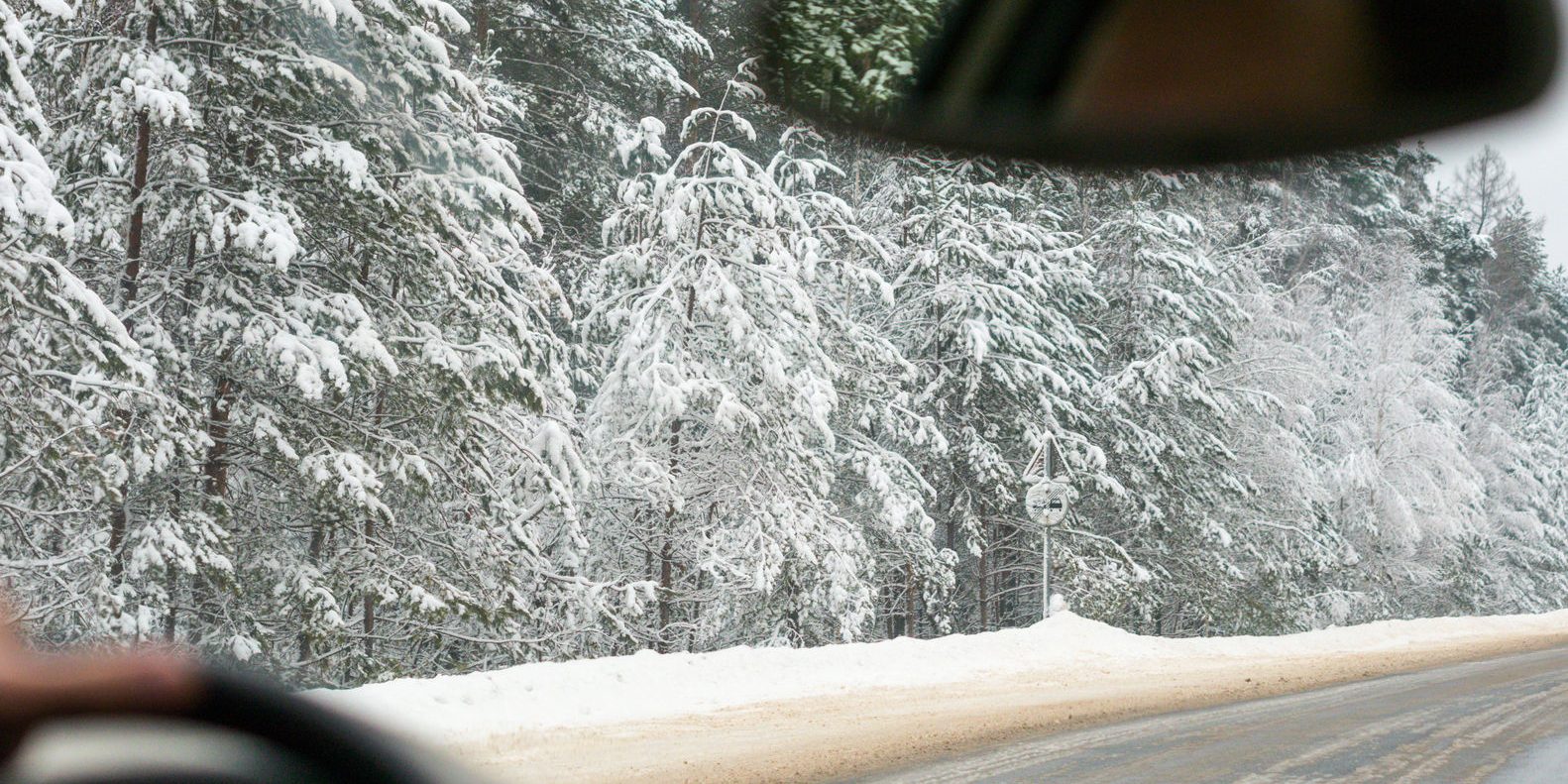 54482224 – winter driving. view from inside vehicle, unrecognizable driver